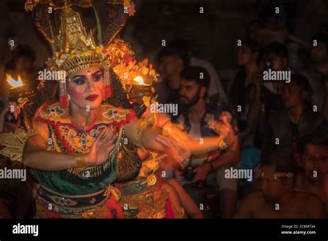 Dramatic photo of colorfully dressed Kecak dancers dressed in ...