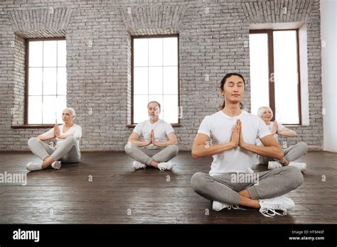 Group of healthy people while meditating Stock Photo - Alamy