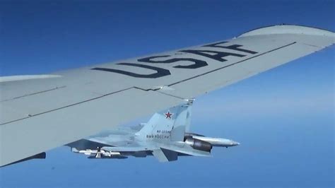 Pentagon releases images of Russian jet buzzing RC-135 spy plane | World News | Sky News