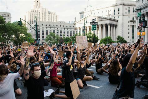 Crowd of Protesters Holding Signs and Kneeling · Free Stock Photo