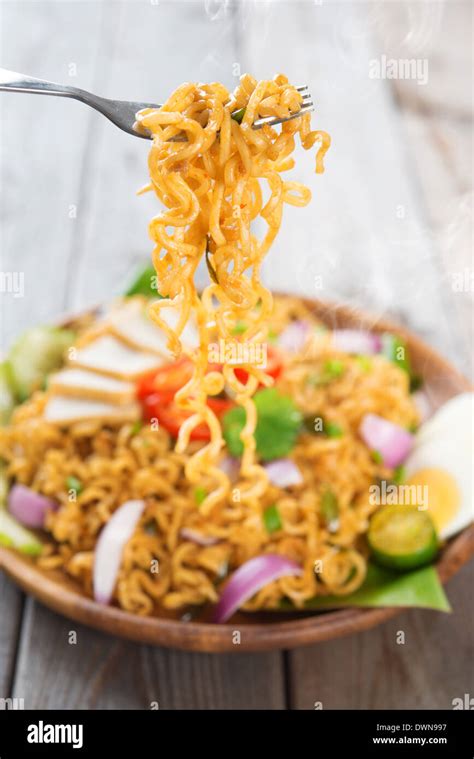 Spicy fried curry instant noodles or Malaysian style maggi goreng mamak ...