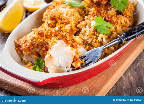 Baked Cod Fish in Breadcrumbs in Gratin Dish Closeup Stock Image - Image of close, cooked: 60288423