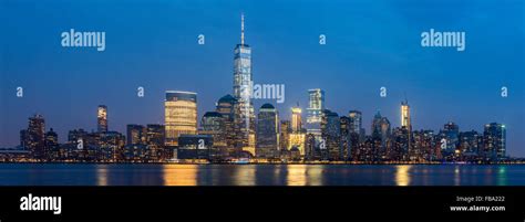 Panoramic view by night of One World Trade Center and Lower Manhattan ...