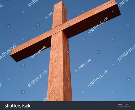 View Looking Up At A Wooden Cross Against Blue Sky. Stock Photo 2546177 ...