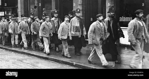 Some of the Belmont Workhouse inmates being escorted to Wandsworth Prison following their court ...