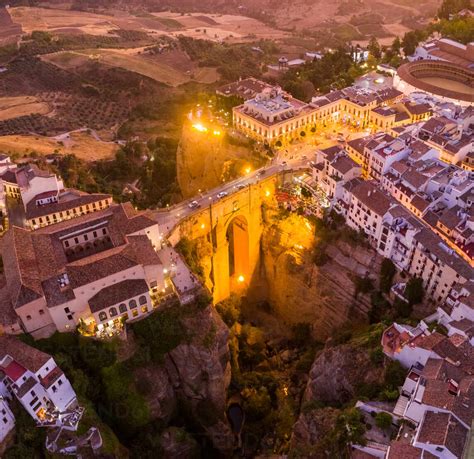 Aerial view of El Tajo Gorge, famous bridge in Ronda during the night, Malaga, Spain stock photo