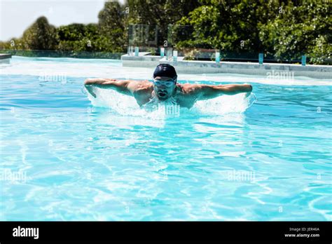 Fit swimmer doing the butterfly stroke Stock Photo - Alamy