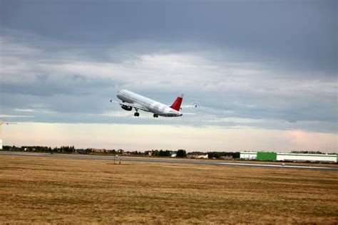 Passenger Plane Takes Off from the Airport Runway. Side-view of Aircraft Stock Photo - Image of ...