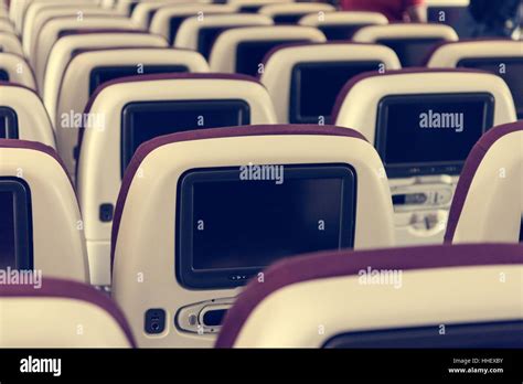 Economy class airplane interior Stock Photo - Alamy