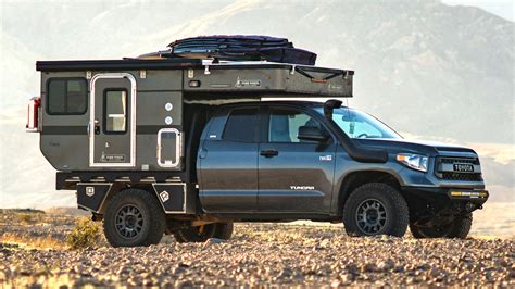 a truck with a camper attached to the back