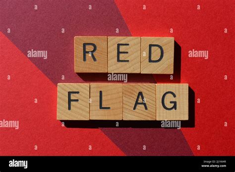 Red Flag, words in wooden alphabet letters isolated on red background as banner headline Stock ...