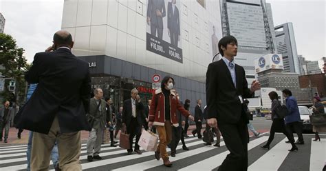 Japan enters unexpected recession as sales tax hike takes toll - Los ...