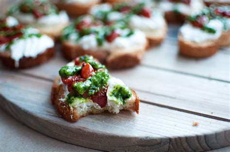 Roasted Tomato Crostini with Basil Pesto - Pretty in Pistachio