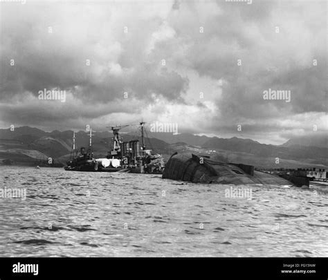 WWII: PEARL HARBOR, 1941. /nA view of the capsized USS Utah and the USS ...