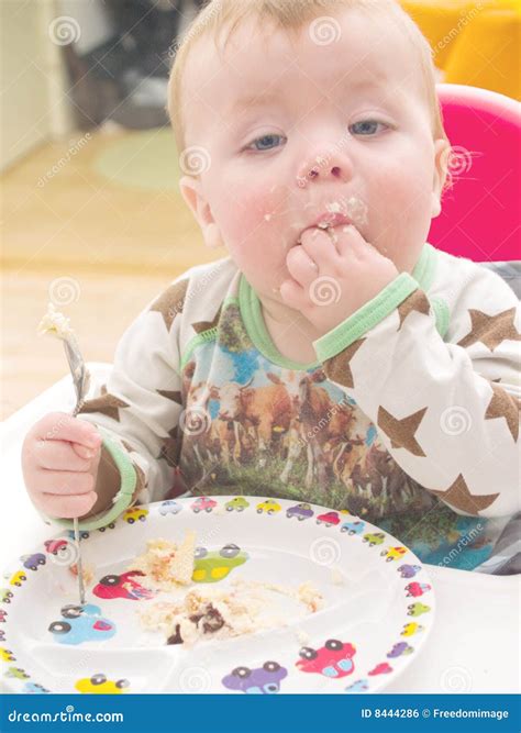 Baby on His First Birthday Eating Cake Stock Photo - Image of highchair, hungry: 8444286