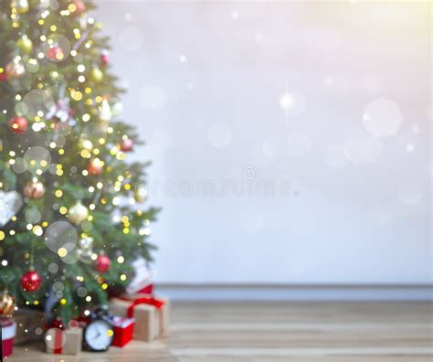 Christmas Background with an Elegant Christmas Tree with Gifts. Blurred Lights Stock Photo ...