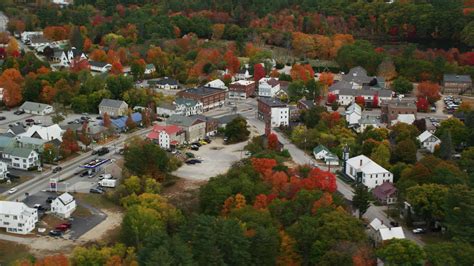 5.5K stock footage aerial video orbiting small rural town with colorful ...