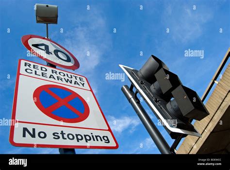 british red route clearway no stopping road sign, with 40mph speed limit sign, in west london ...