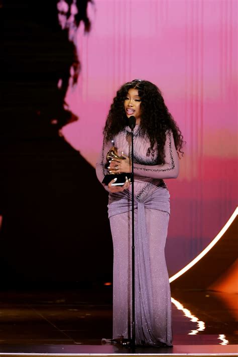 SZA Wore a transparent Bedazzled Optical Illusion Dress to Accept Her Grammy Award