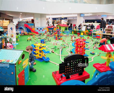 Kids playing in game zone in shopping mall. Play zone in modern shopping mall, kids zone. Copy ...