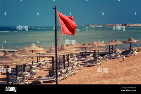 Red warning flag on beach Stock Photo - Alamy