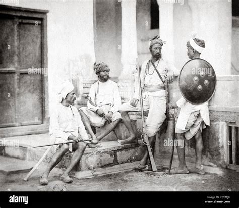 Late 19th century photograph - Chohan Rajputs, with gun and swords, India. Shepherd and ...