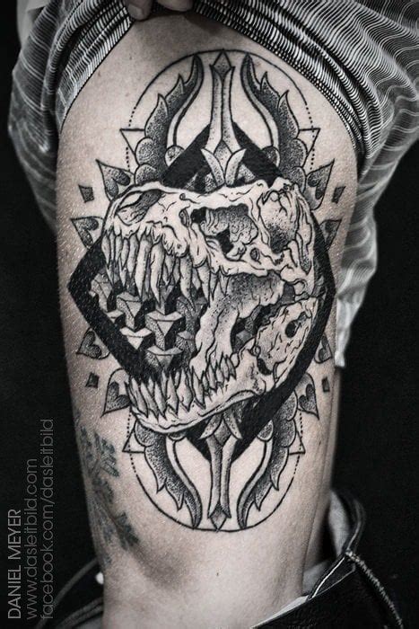 A dinosaur skull roars out from the center of a mandala design in this ...