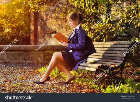 Blond Girl Sitting On Bench Reading Stock Photo 262539596 | Shutterstock