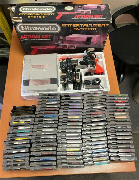 NINTENDO NES CONSOLE ACTION SET USED IN ORIGINAL BOX WITH -99- GAMES