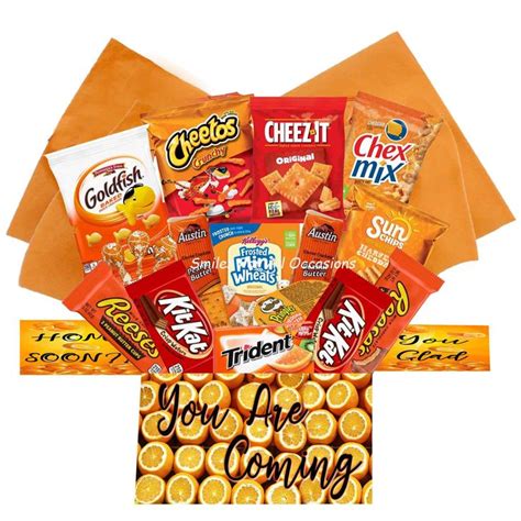 an orange basket filled with snacks and candy