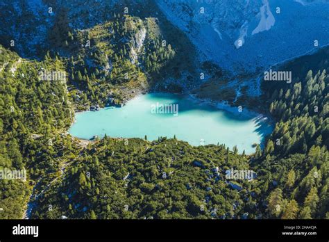 Aerial view of turquoise mountain sorapiss lake in dolomites hi-res ...