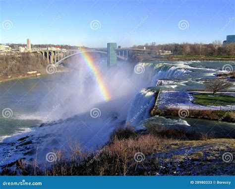 Rainbow Over Niagara Falls and Rainbow Bridge Stock Image - Image of ...