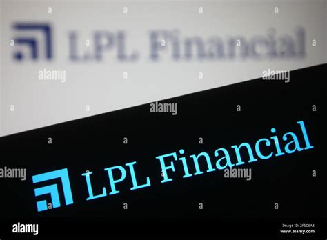 In this photo illustration the LPL Financial logo is seen on a smartphone and a pc screen Stock ...