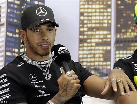 Lewis Hamilton unveils new Mercedes race suit to promote Black Lives ...