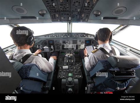 pilots in the cockpit of the KBX, Fokker 70 of the Dutch Government Stock Photo - Alamy