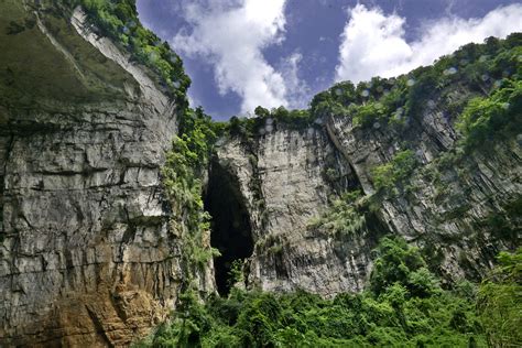 Explore the waterfall hidden in the karst sinkhole in SW China - CGTN