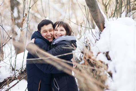 Winter Portrait of a Young Interracial Couple As they Hug Each Other Stock Image - Image of ...