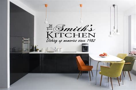 Personalized vinyl wall art on kitchen wall. Modern kitchen white wall and black lettering ...