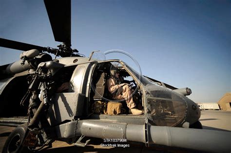 A pilot sits in the cockpit of a HH-60G Pave Hawk. | Stocktrek Images