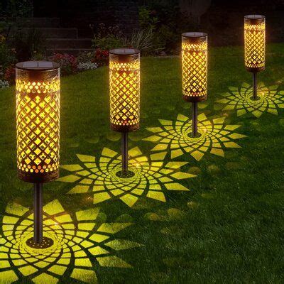 outdoor solar lights in the shape of flower petals on green grass with ...