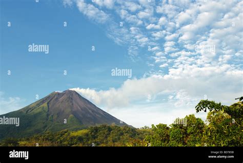 The large, active volcano's smoke plume leaves a visible train in the ...