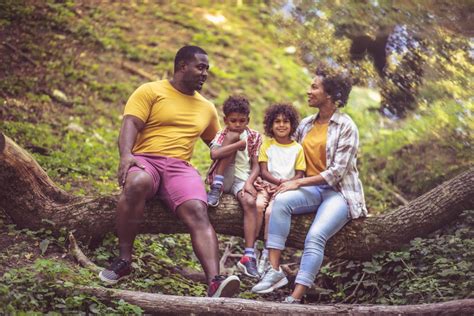 Love. African American family having fun outdoors. photo – African ...