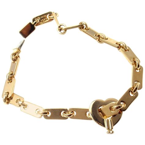 Cartier Gold Heart Lock Charm Link Bracelet at 1stdibs