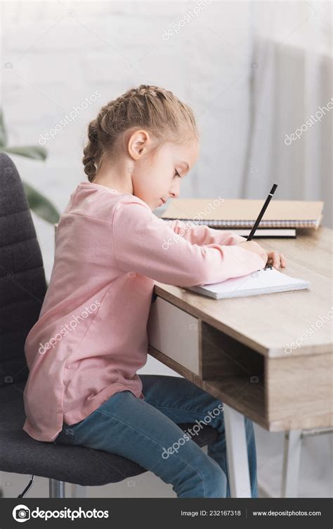 Kid sitting at desk | Beautiful Focused Kid Sitting Desk Studying Home — Stock Photo ...