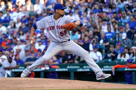 Download Carlos Carrasco Pitching With Crowd Wallpaper | Wallpapers.com