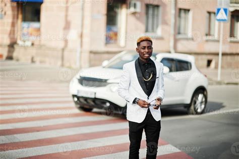 Chic handsome african american man in white suit walking on crosswalk ...