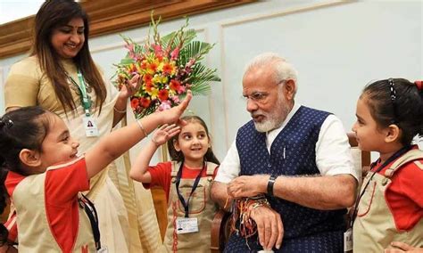 Children, women tie 'rakhi' to PM Narendra Modi.