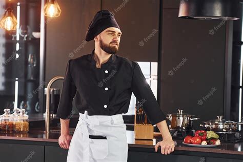 Premium Photo | Portrait of professional young chef cook in uniform that posing for camera on ...