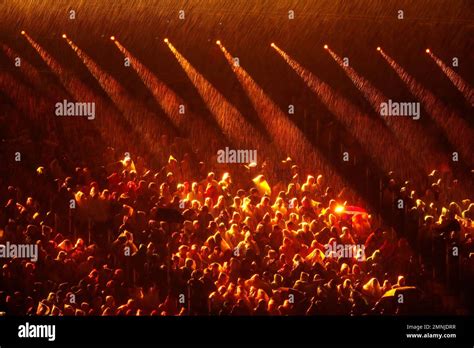 Lights illuminates rain at Carrara Stadium just before for the opening ...