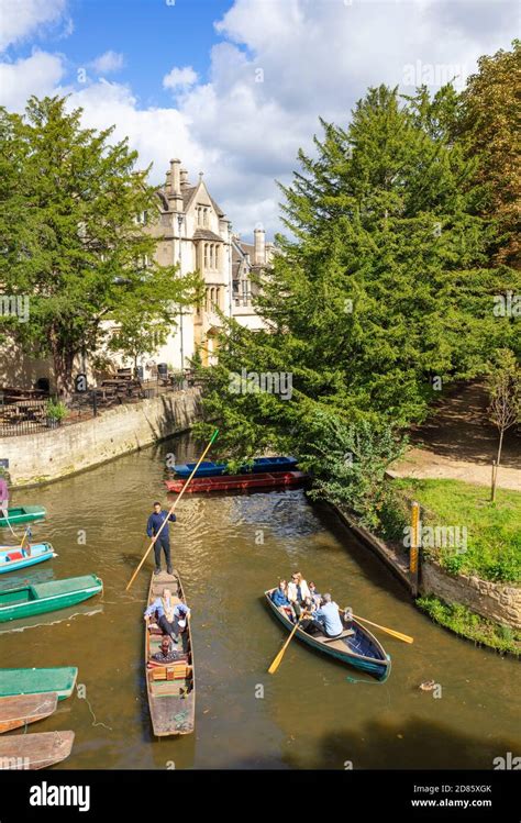 People punting on punts hired at Oxford Punting Magdalen Bridge Boathouse Magdalen College on ...